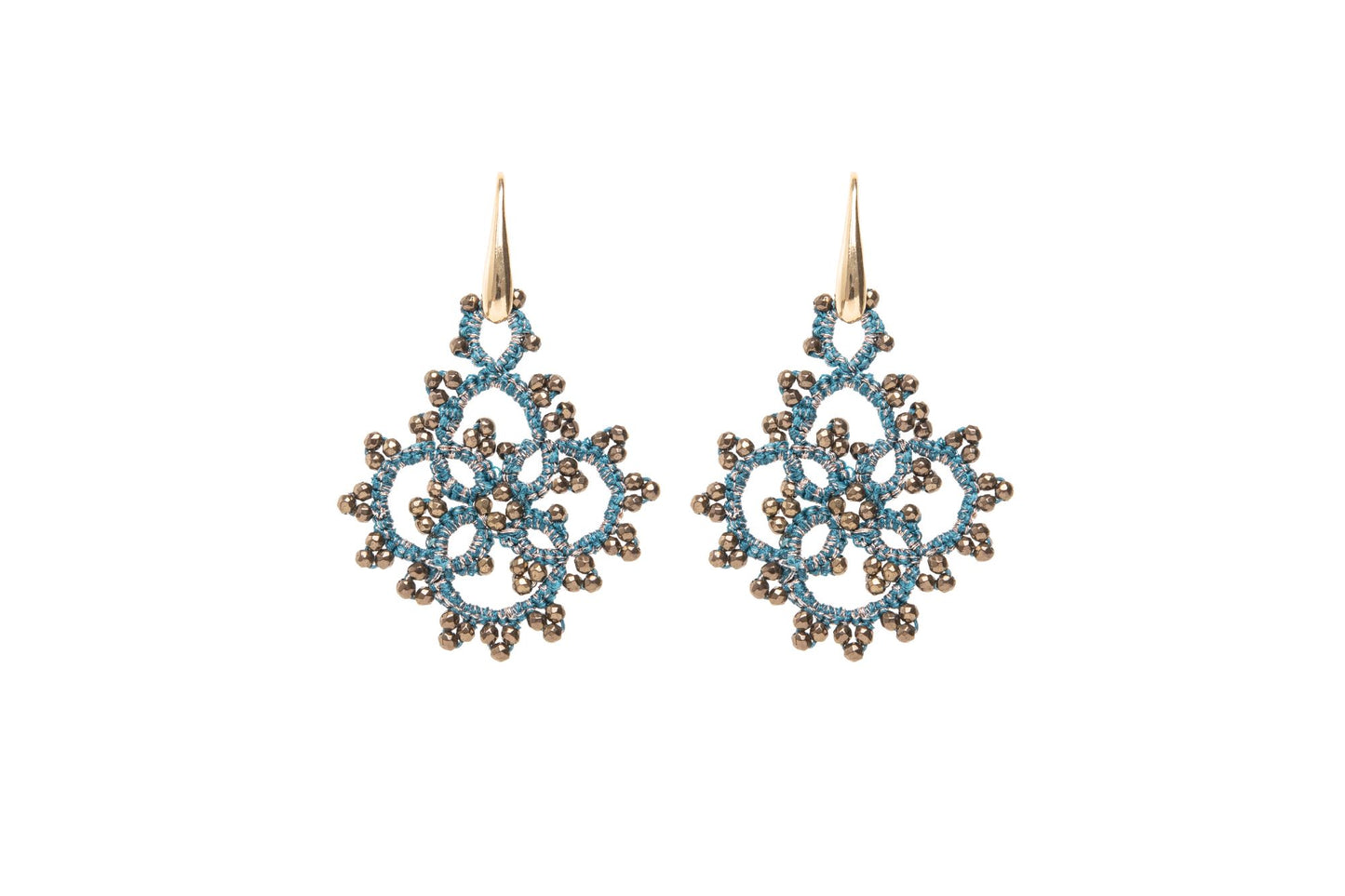Snowflake-shaped earrings blue gold on white background