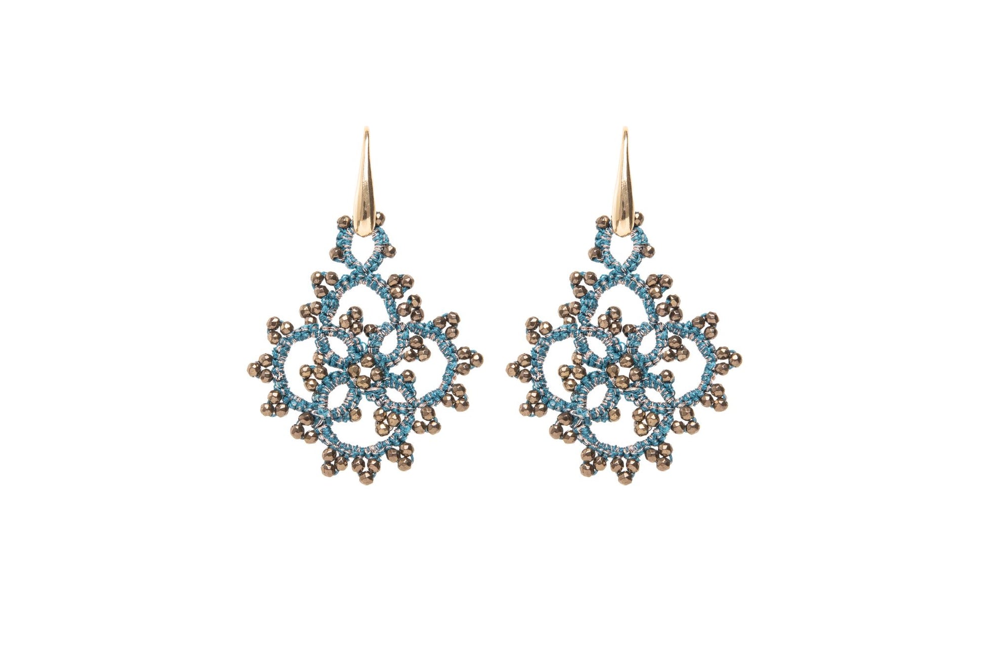 Snowflake-shaped earrings blue gold on white background