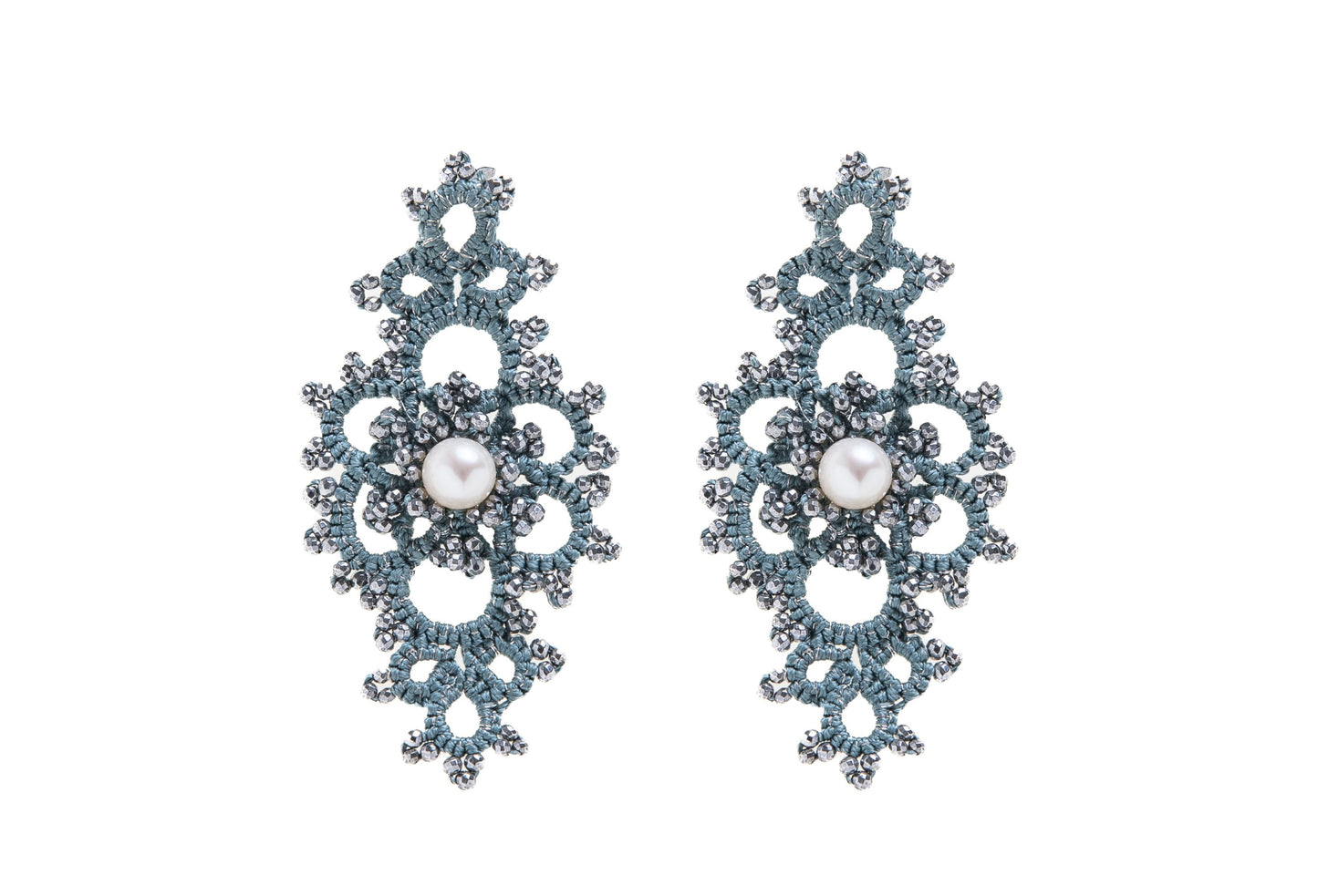 Grace handcrafted earrings with pearls on a white background