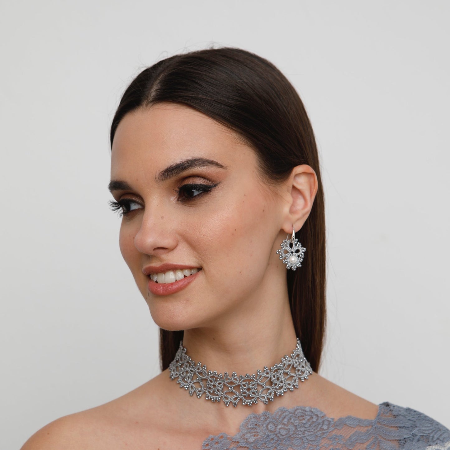 Claire handcrafted gemstone lace earrings being worn