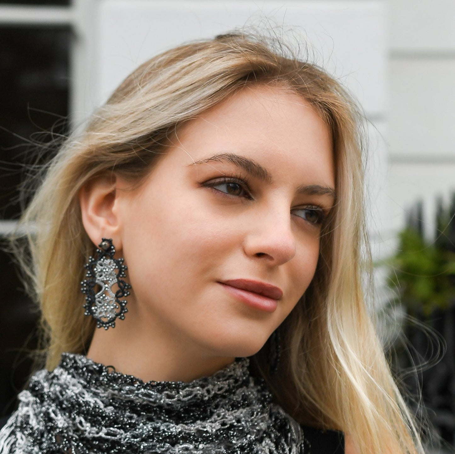 Art Deco handcrafted gemstones lace earrings being worn