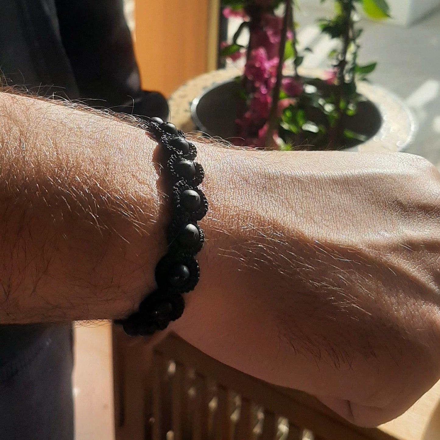 Avatar handcrafted gemstone lace bracelet being worn