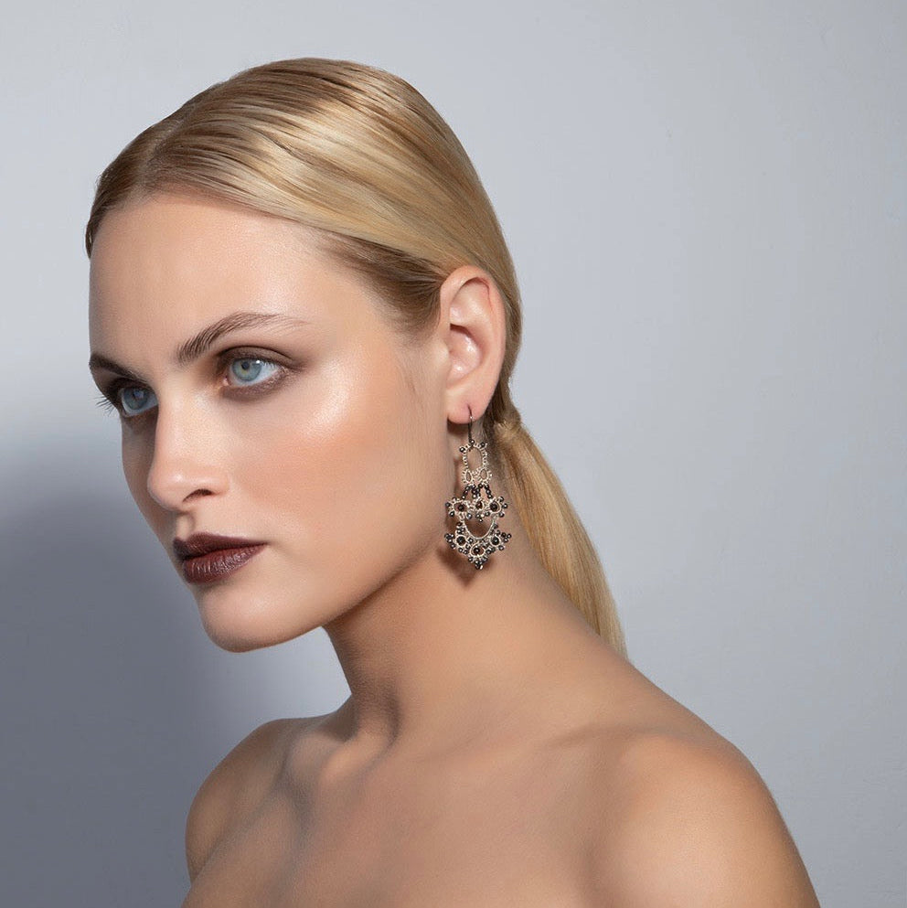 Bijoux handcrafted lace earrings worn by a model