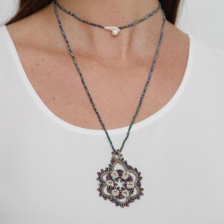 Flower handcrafted gemstone lace pendant rainbow being worn