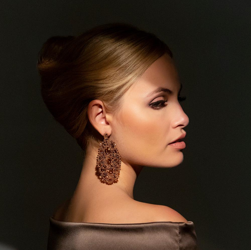 Iris handcrafted gemstone lace earrings being worn