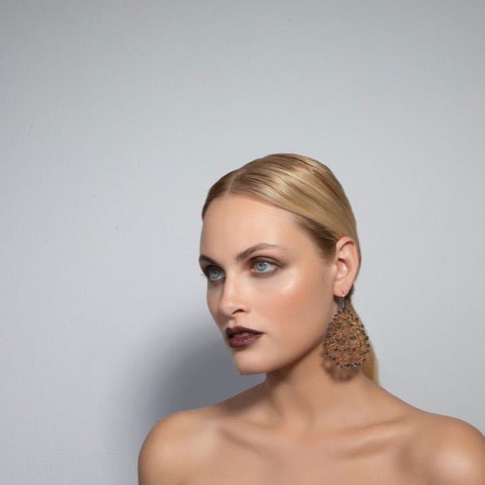 Gaia handcrafted gemstone lace earrings being worn