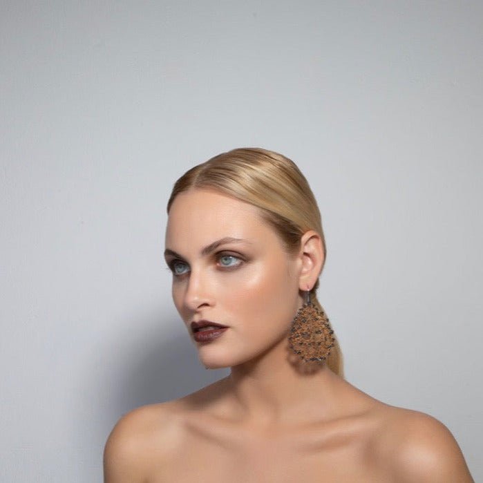 Gaia handcrafted gemstone lace earrings being worn