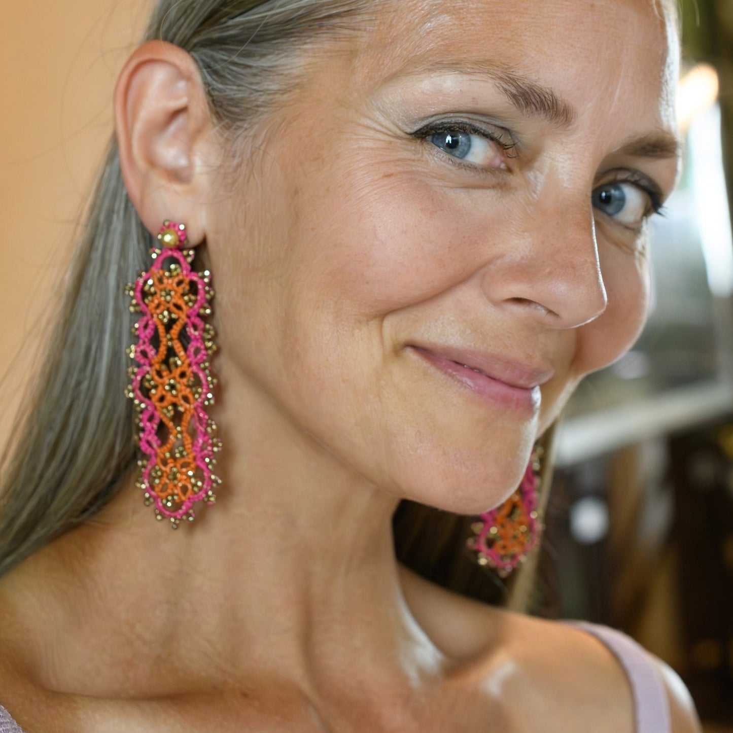 Vintage Art Deco handcrafted gemstone lace earrings being worn