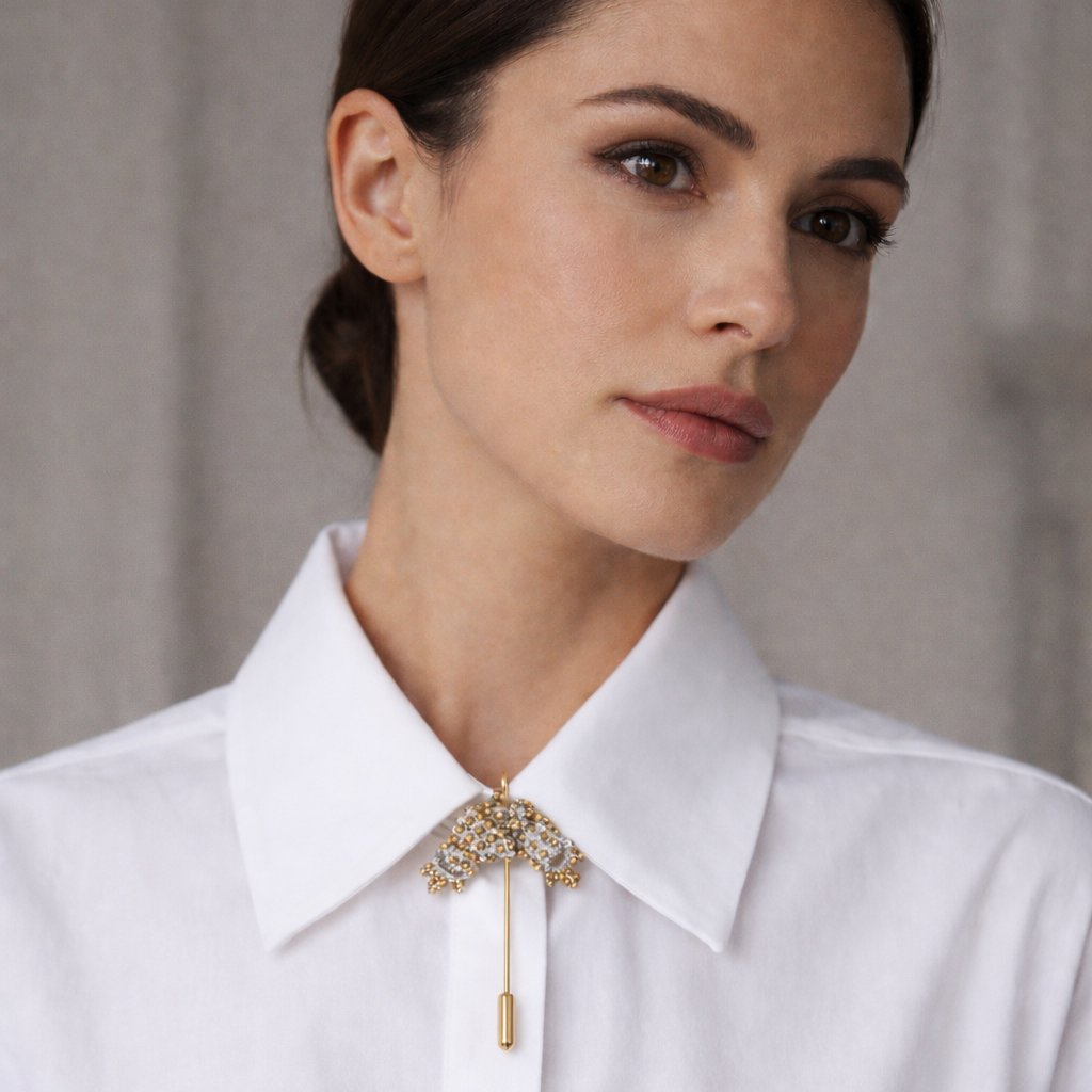 Woman wearing a white shirt with a japanese bow lace brooch