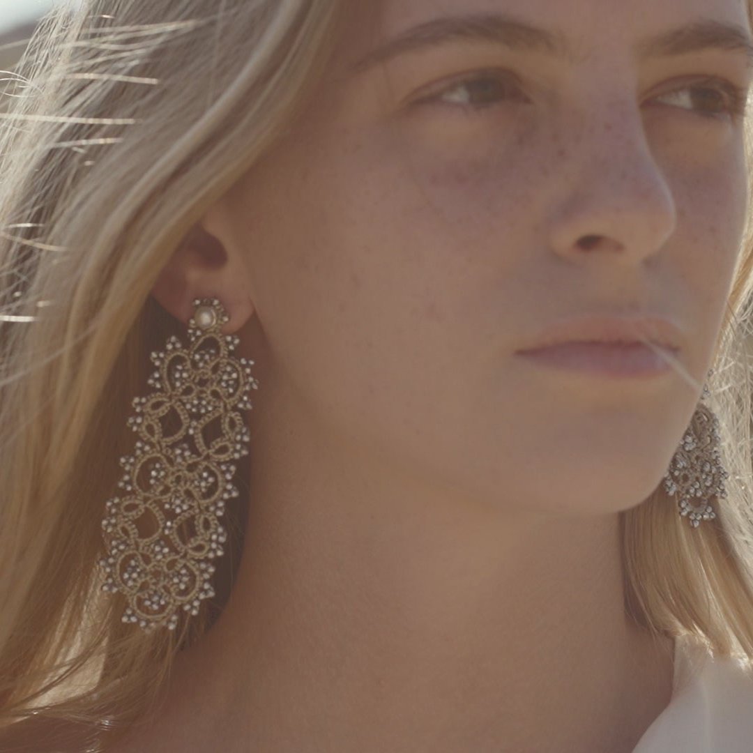 View of Art Deco handcrafted gemstones earrings being worn