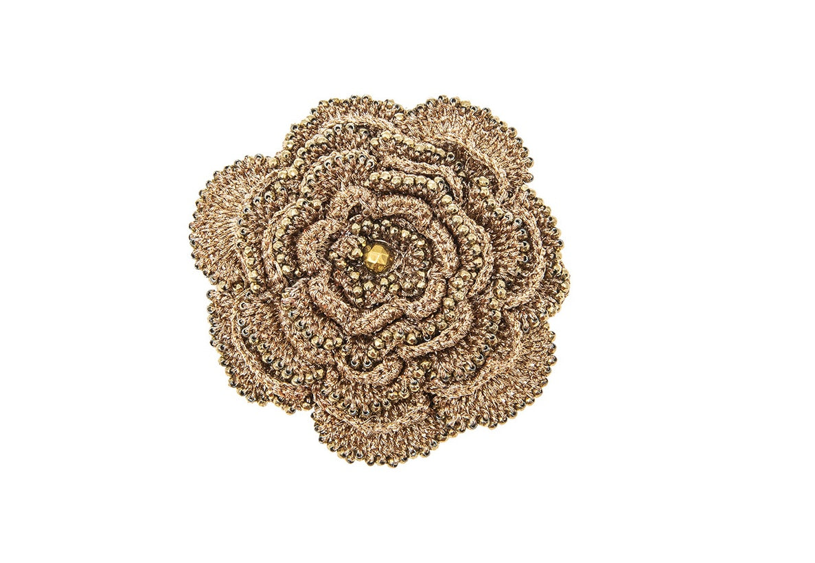 Hand-crocheted Camelia brooch, gold close up