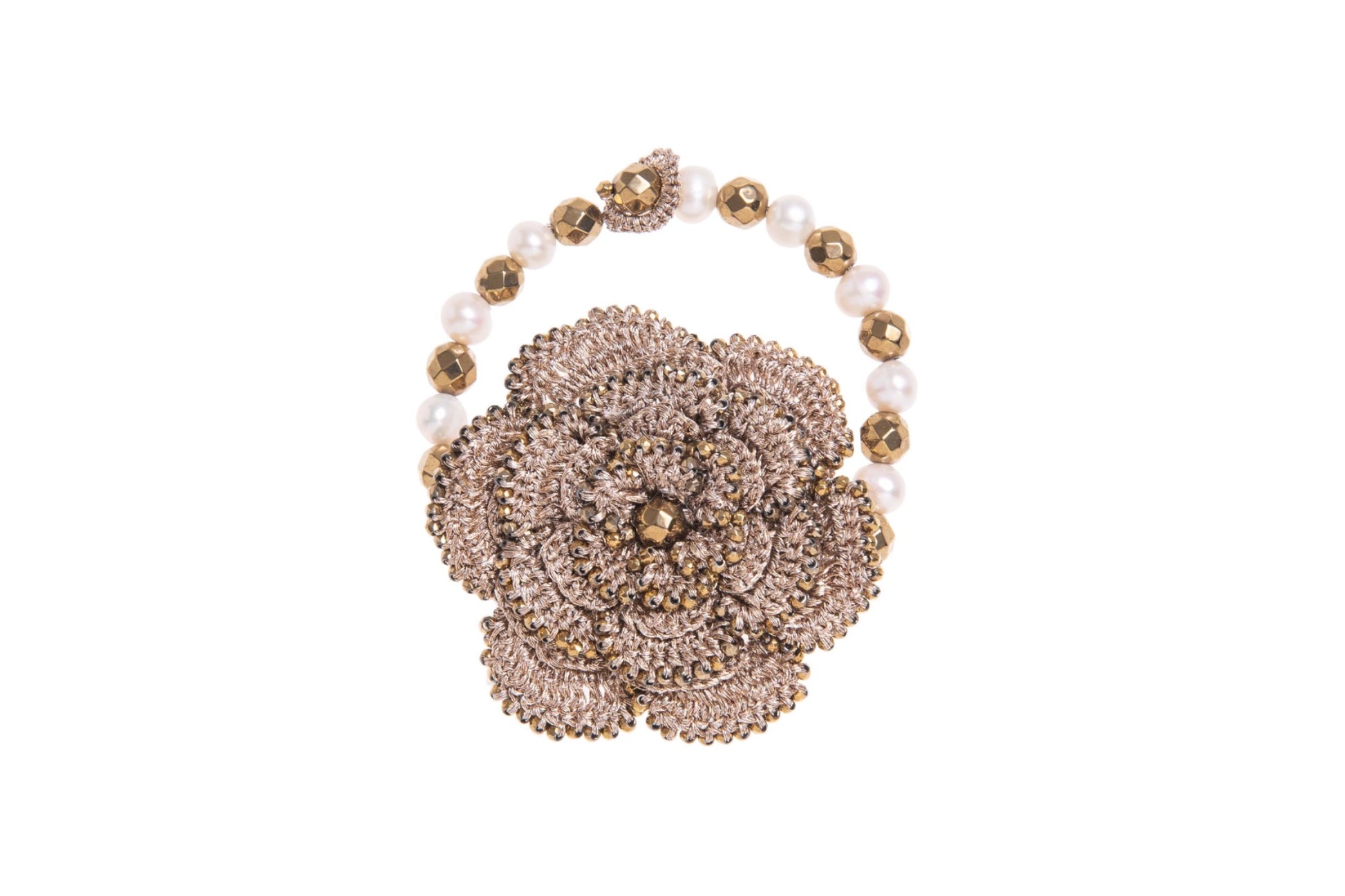 Hand~crocheted bracelet with floral design, gemstones & pearls on a white background