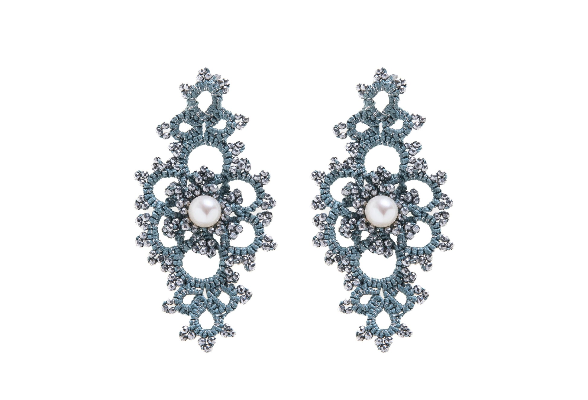 Grace handcrafted earrings with pearls on a white background