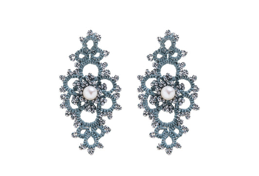 Grace handcrafted earrings with pearls on a white background