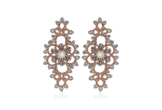 Grace handcrafted lace earrings with pearls on a white background