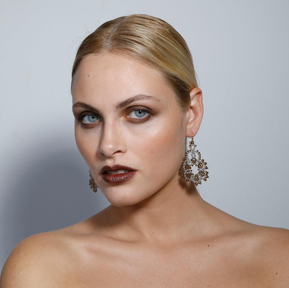 Agatha handcrafted gemstone lace earrings being worn