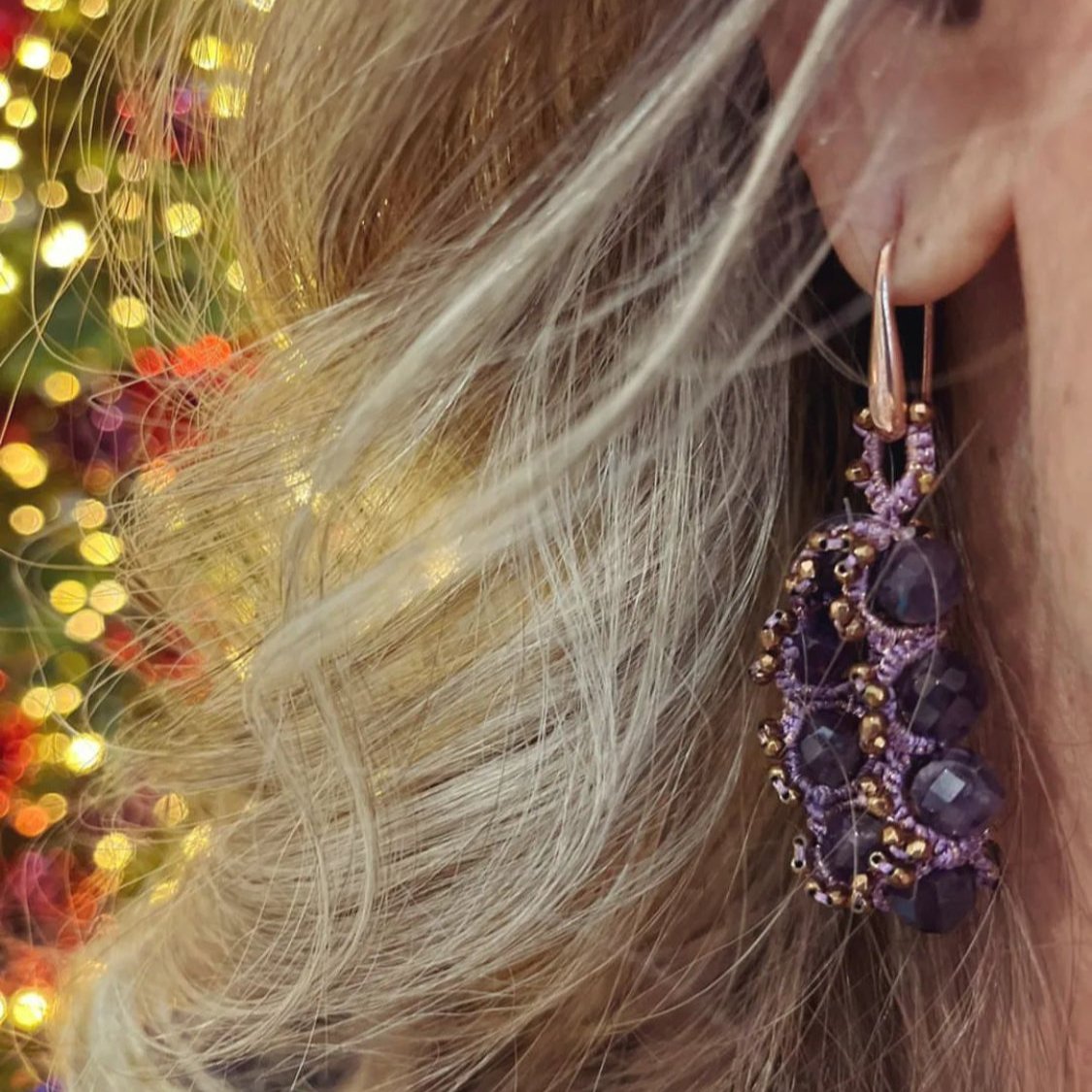 Hoop handcrafted gemstone lace earrings being worn