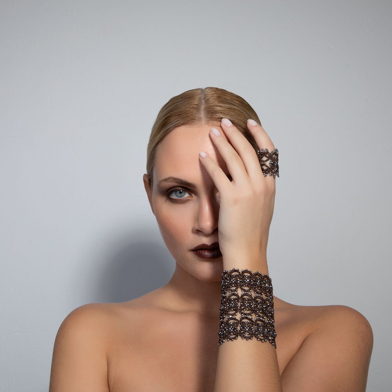 Anastasia handcrafted gemstone lace bracelet being worn