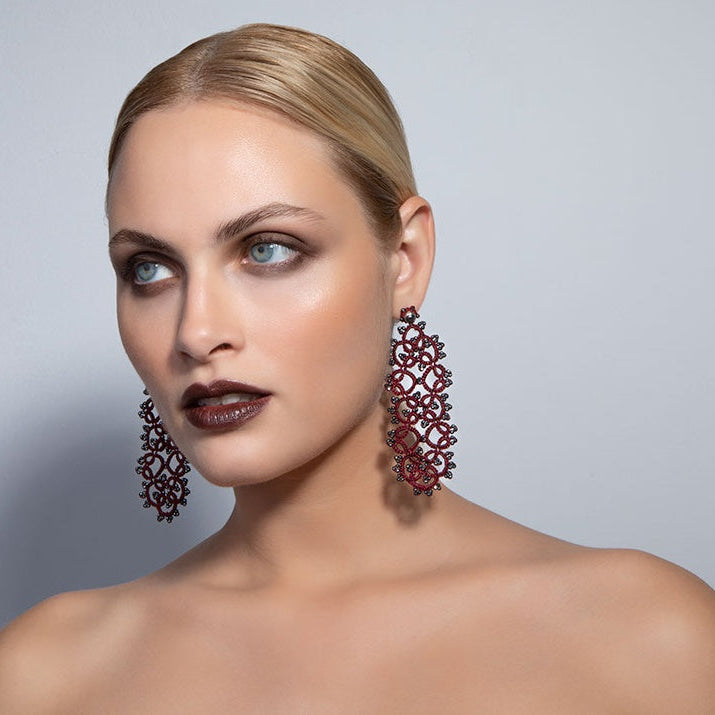 Art Deco handcrafted large lace earrings being worn 