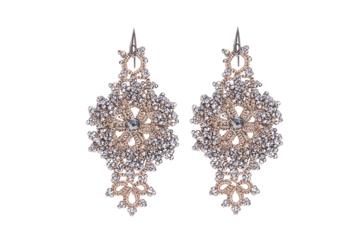 Pair of handcrafted lace earrings on a white background