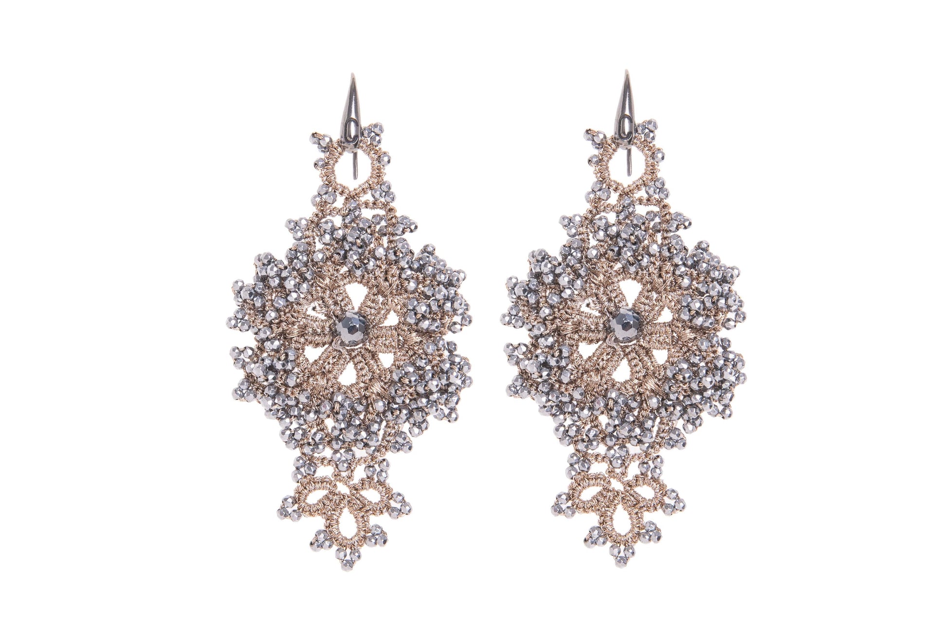 Pair of handcrafted lace earrings on a white background