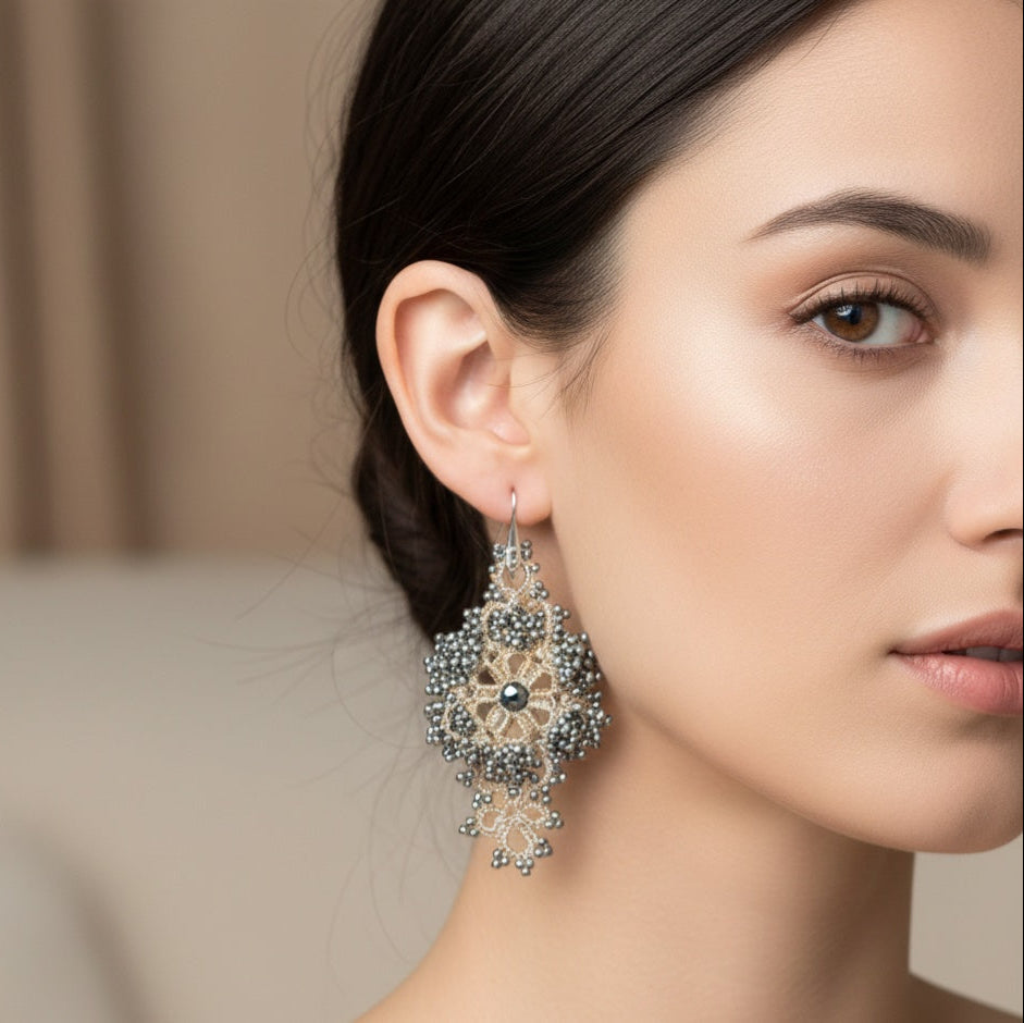 Handcrafted lace Callista earrings on a model