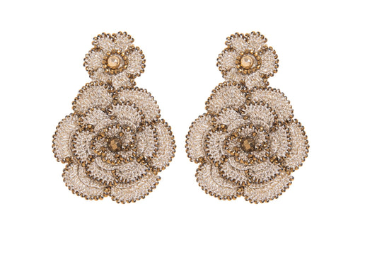 Pair of floral hand~crocheted earrings design on a white background