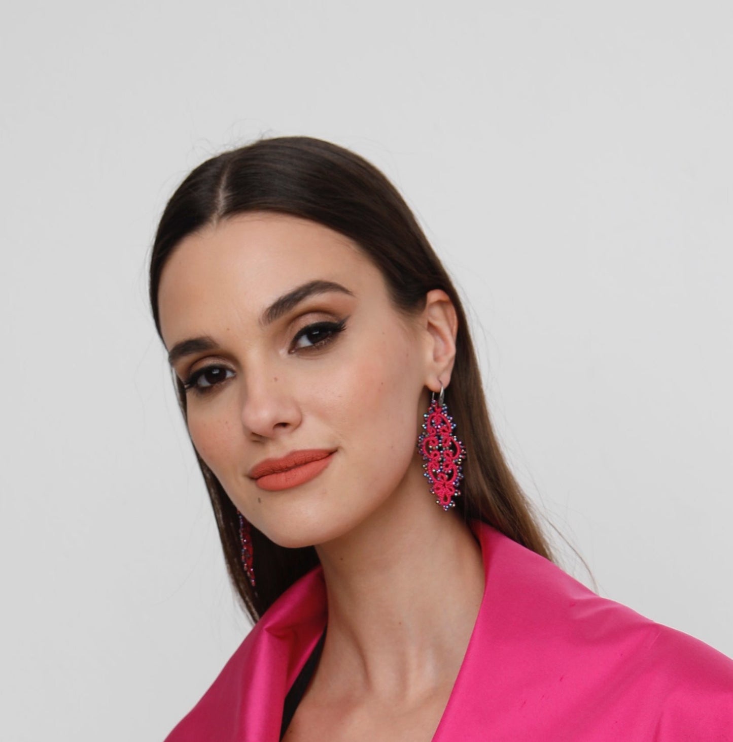 Carol handcrafted gemstone lace earrings being worn 