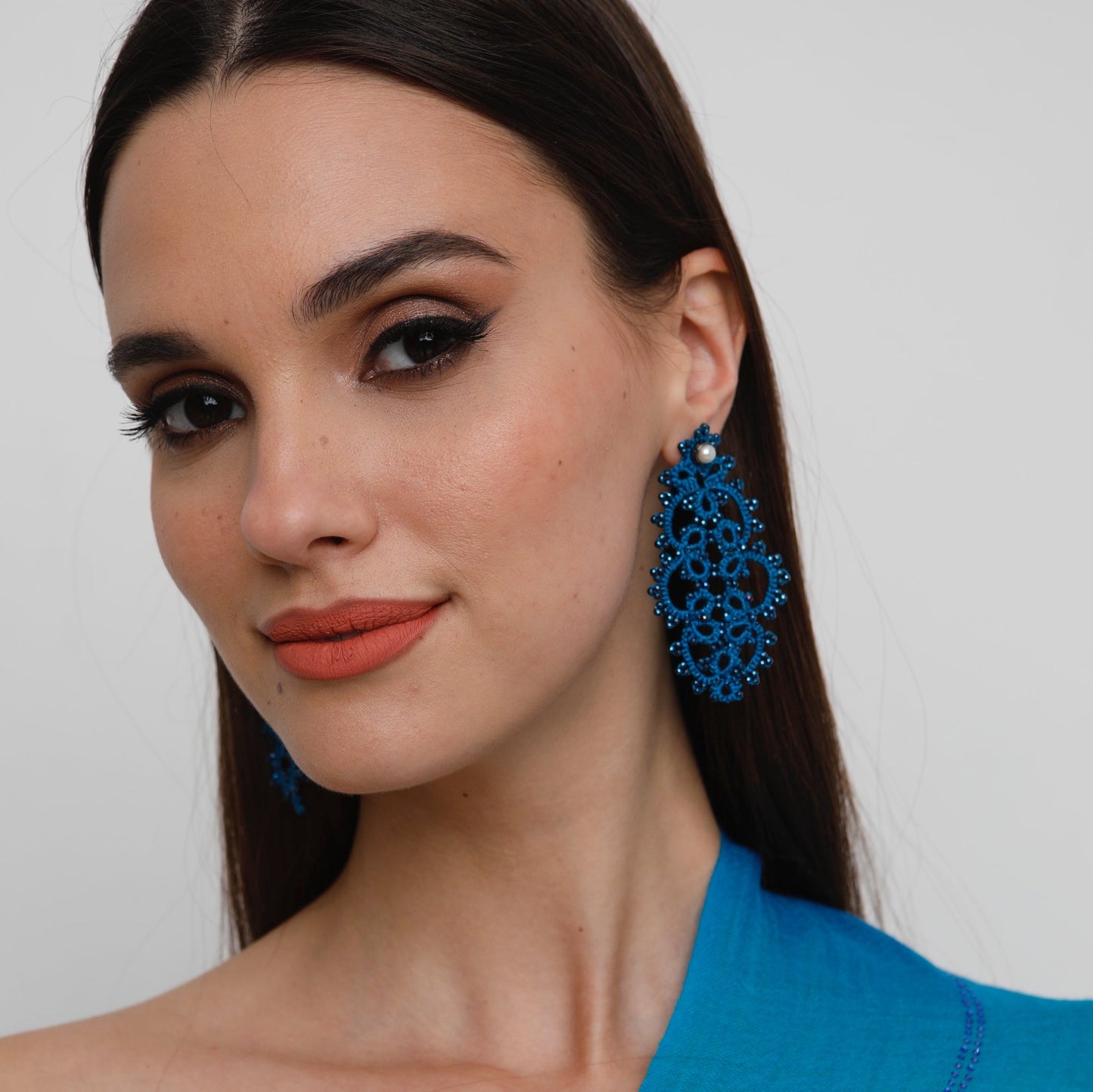 Vintage Carol handcrafted gemstone lace earrings being worn 