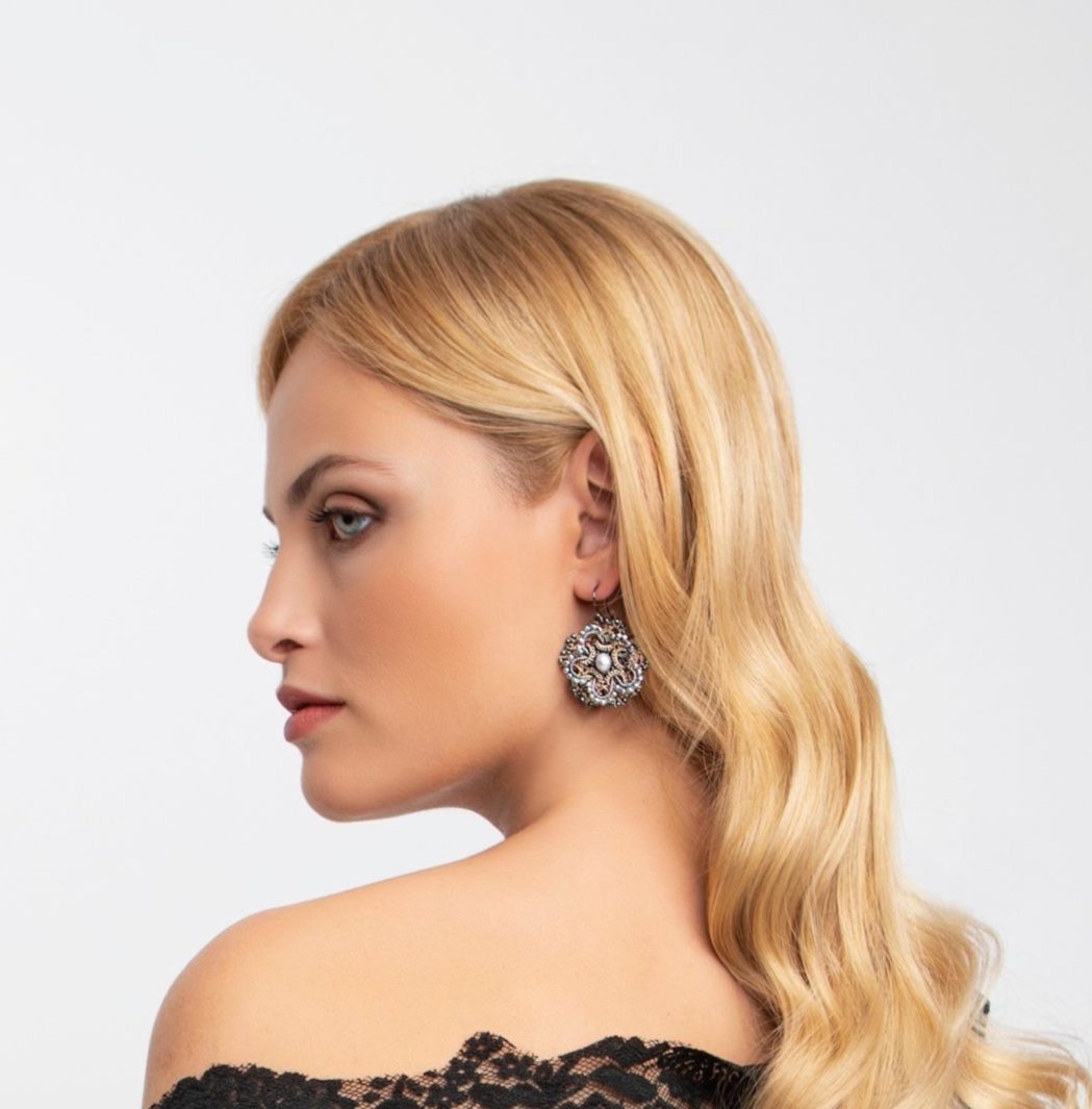 Chic handcrafted gemstone lace earrings being worn