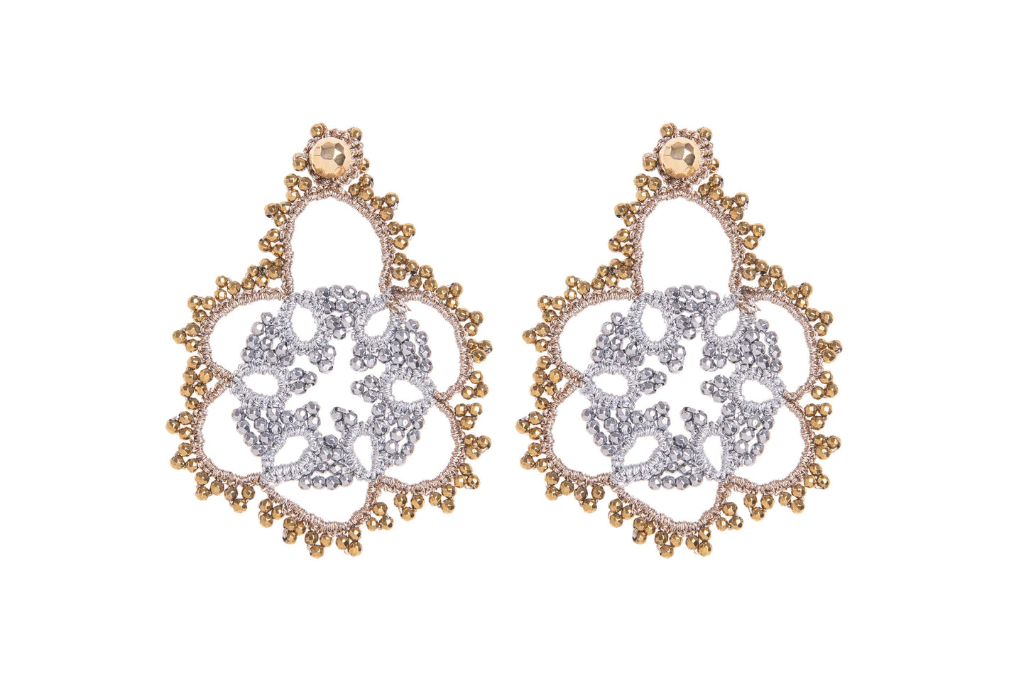 Pair of gold and silver earrings on a white background