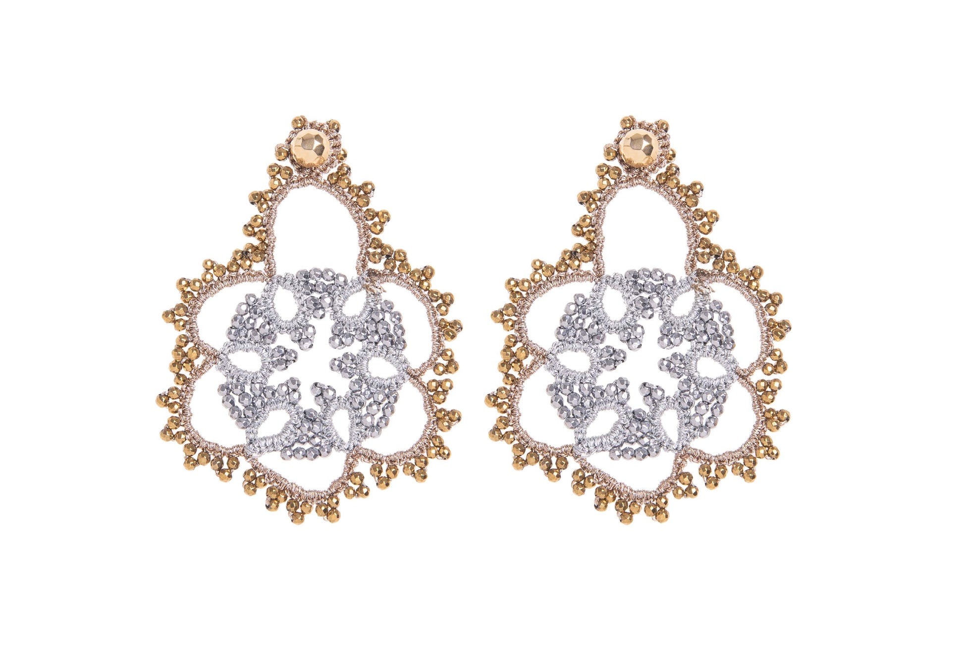 Pair of gold and silver earrings on a white background
