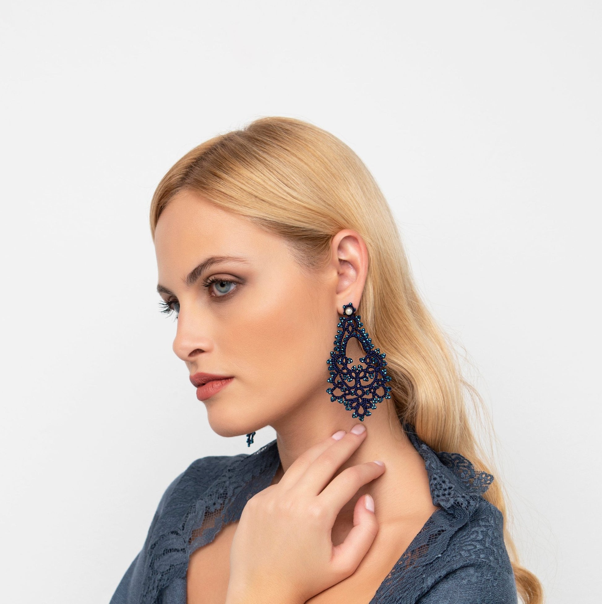 Godiva handcrafted gemstone lace earrings being worn