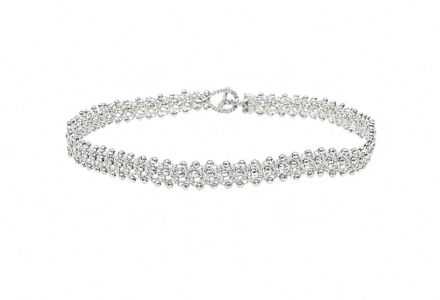 Tennis handcrafted lace silver choker with gemstones on a white background