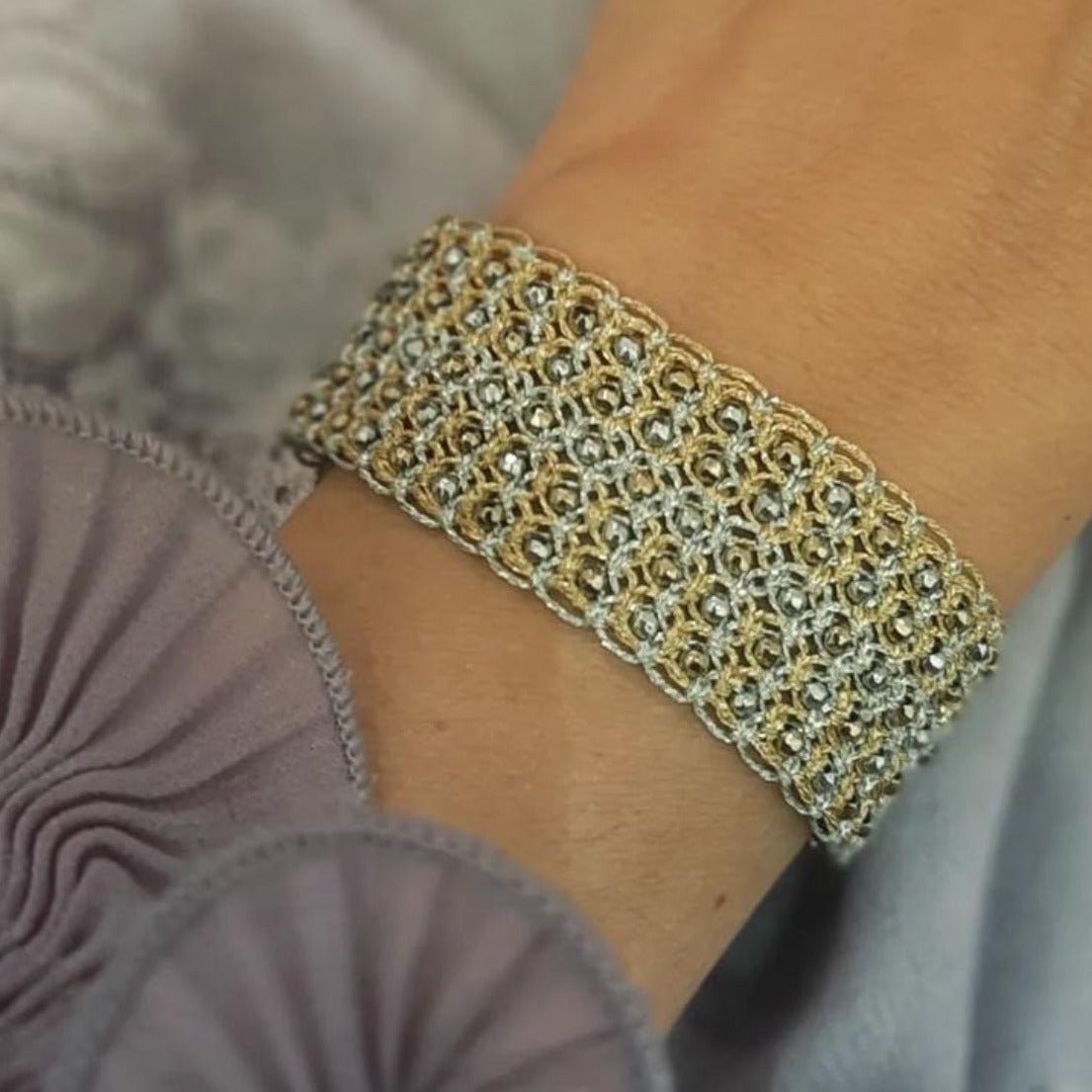 Fine large handcrafted gemstone lace bracelet being worn